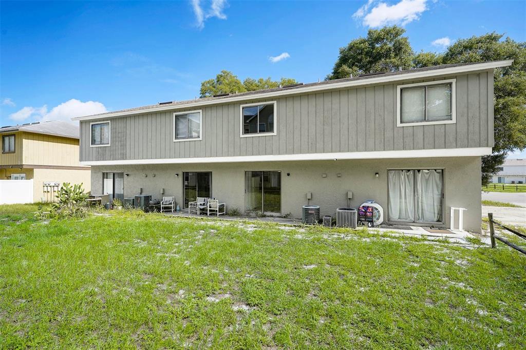 12062 Tift Circle Orlando, FL 32826 - Photo 23 of 26 a view of a house with a yard and sitting area