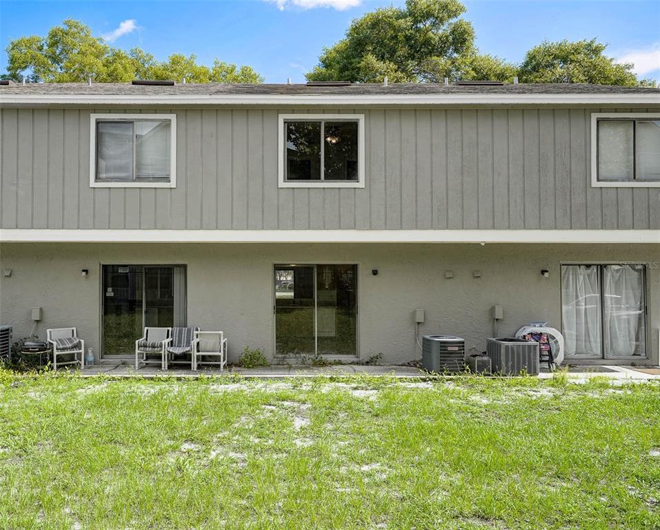 12062 Tift Circle Orlando, FL 32826 - Photo 24 of 26 a view of a backyard with table and chairs