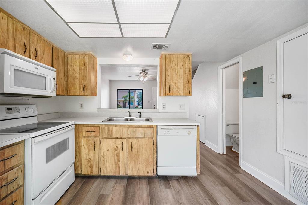 12062 Tift Circle Orlando, FL 32826 - Photo 8 of 26 a kitchen with a sink stove and cabinets