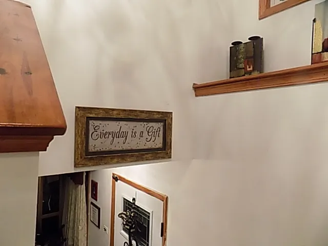 a view of house with backyard and outdoor seating