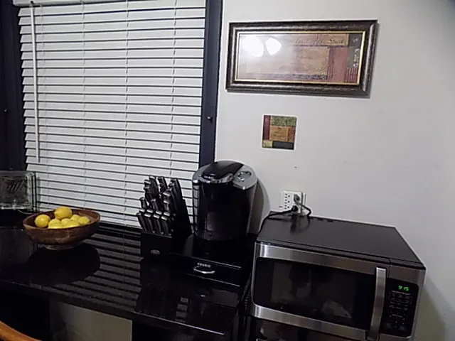 a view of a workspace with furniture