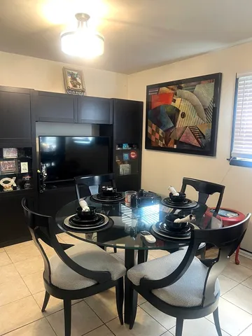 a room with furniture and air hockey table