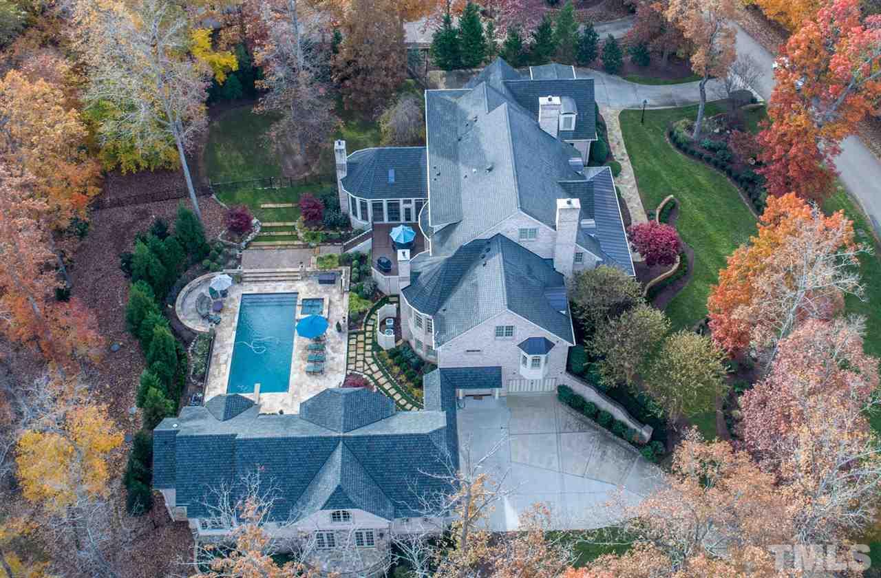 3032 Cone Manor Lane Raleigh, NC 27613 - Photo 2 of 30 an aerial view of a house with a garden and trees