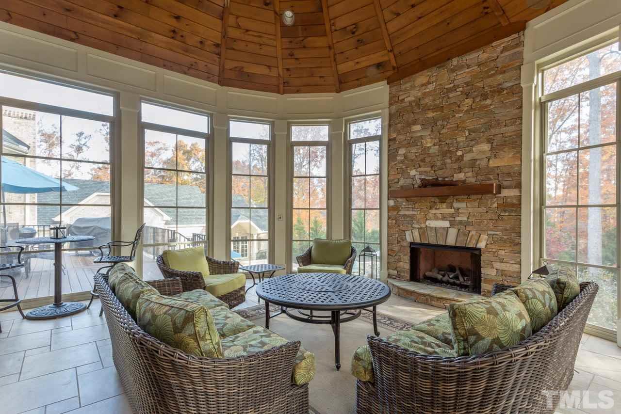 3032 Cone Manor Lane Raleigh, NC 27613 - Photo 11 of 30 a living room with furniture and a fireplace