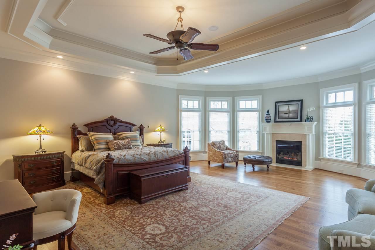 3032 Cone Manor Lane Raleigh, NC 27613 - Photo 15 of 30 a living room with furniture large window and a fireplace