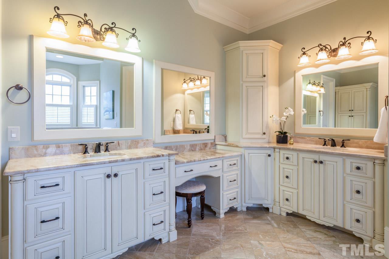 3032 Cone Manor Lane Raleigh, NC 27613 - Photo 18 of 30 a spacious en suite bathroom with double sink and a mirror