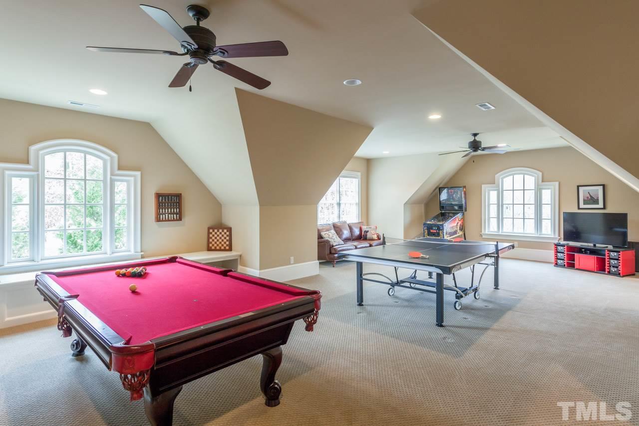 3032 Cone Manor Lane Raleigh, NC 27613 - Photo 23 of 30 a living room with furniture pool table and windows