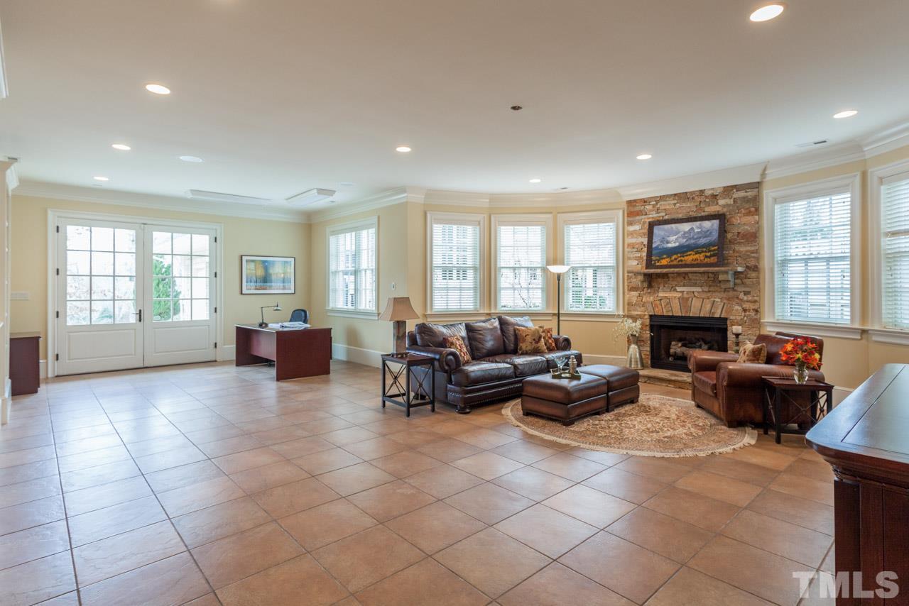 3032 Cone Manor Lane Raleigh, NC 27613 - Photo 25 of 30 a living room with furniture window and fireplace