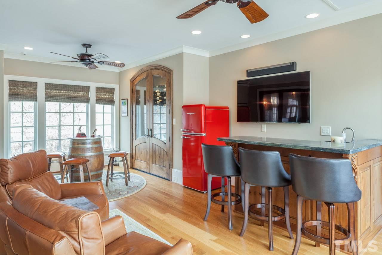 3032 Cone Manor Lane Raleigh, NC 27613 - Photo 28 of 30 a view of a livingroom with furniture window and wooden floor
