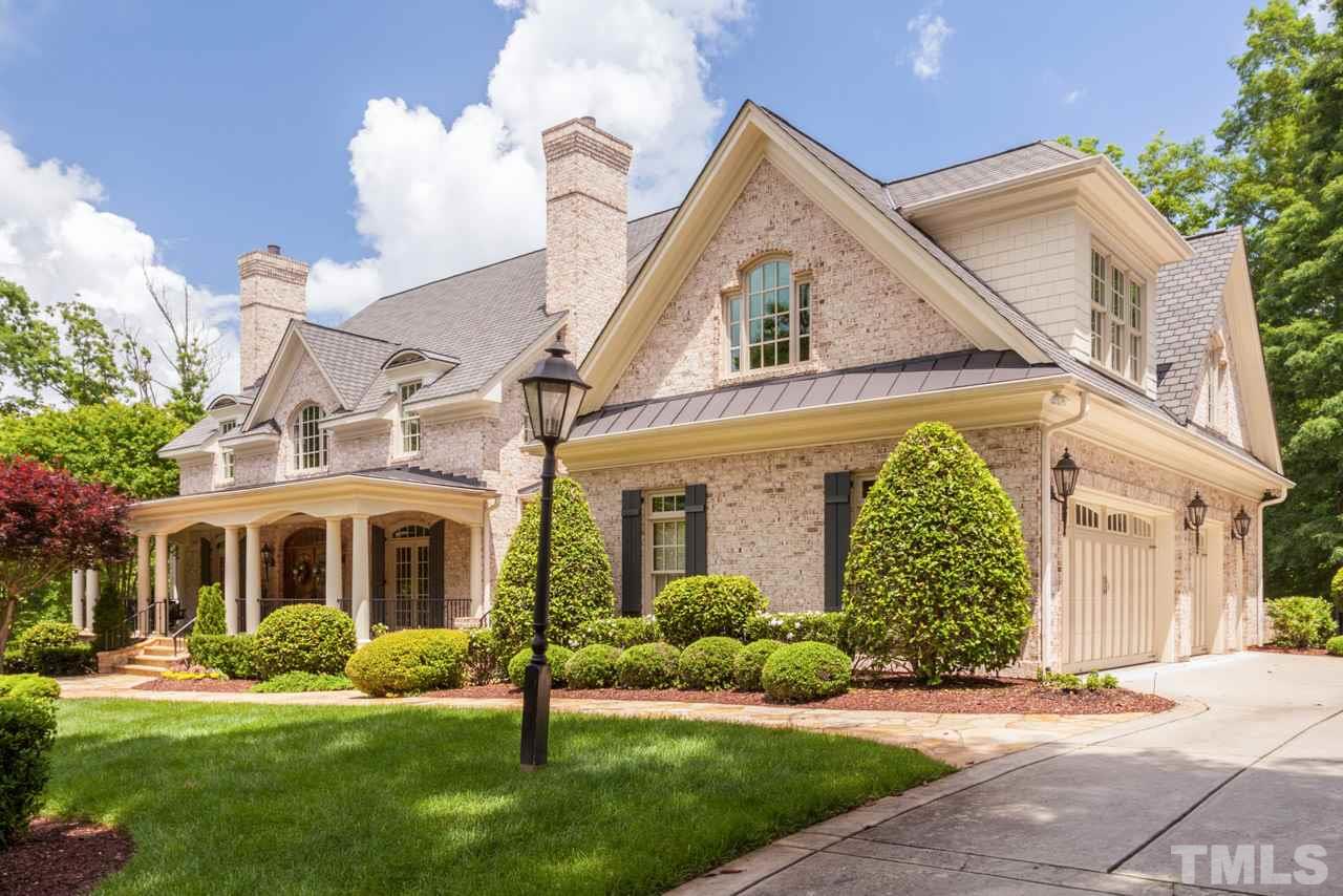 3032 Cone Manor Lane Raleigh, NC 27613 - Photo 30 of 30 a view of a white house with a yard and plants
