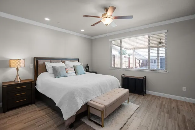 a bedroom with a large bed and a tv