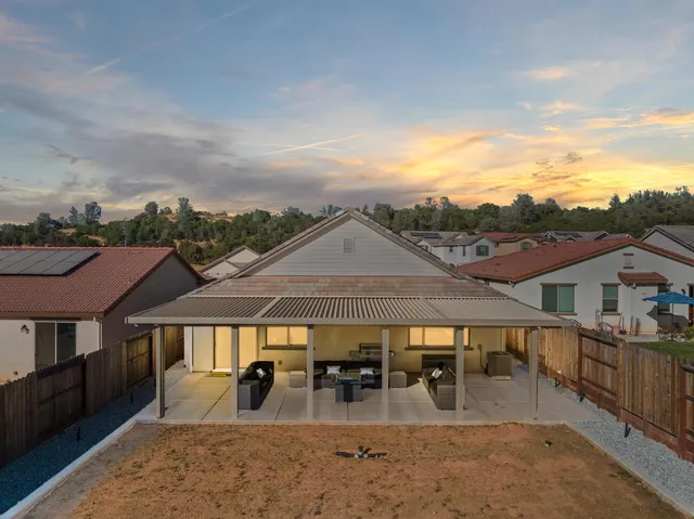 swimming pool view with a seating space