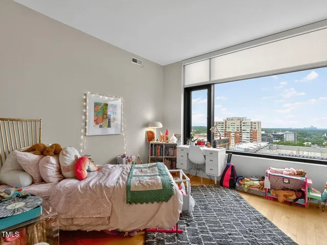 a bedroom with furniture and a window