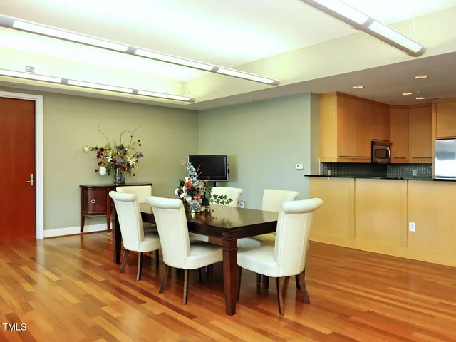 a view of a dining room with furniture and wooden floor