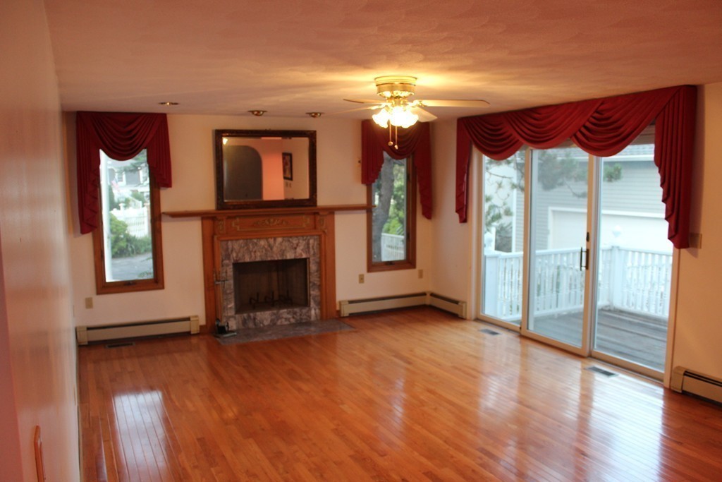 145 Puritan Road Swampscott, MA 01907 - Photo 7 of 19 a view of livingroom with furniture and a fireplace