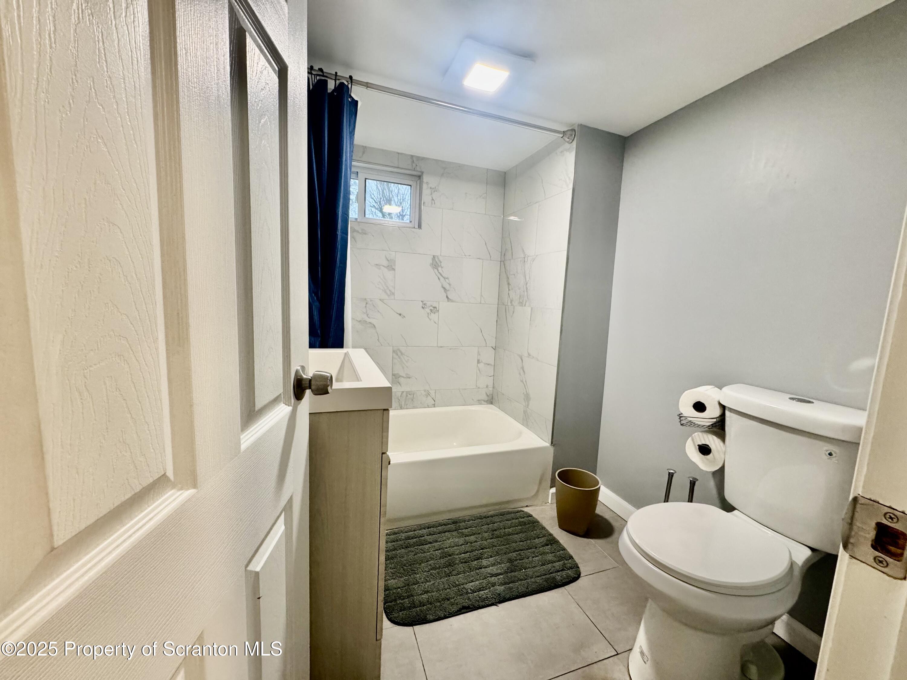 4 Maple Street Pittston, PA 18640 - Photo 18 of 25 a bathroom with a sink toilet and shower