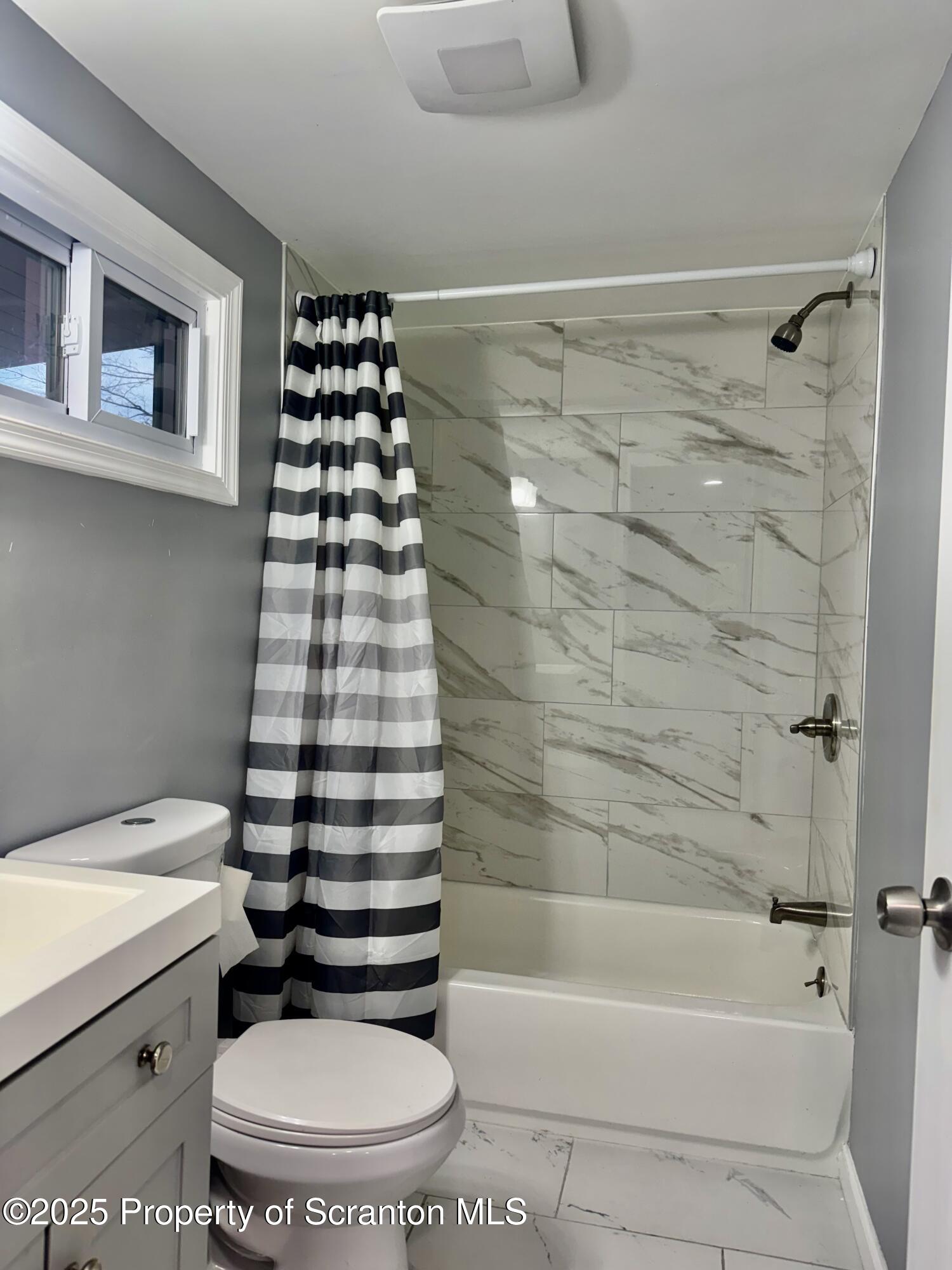 4 Maple Street Pittston, PA 18640 - Photo 19 of 25 a bathroom with a bathtub and a toilet