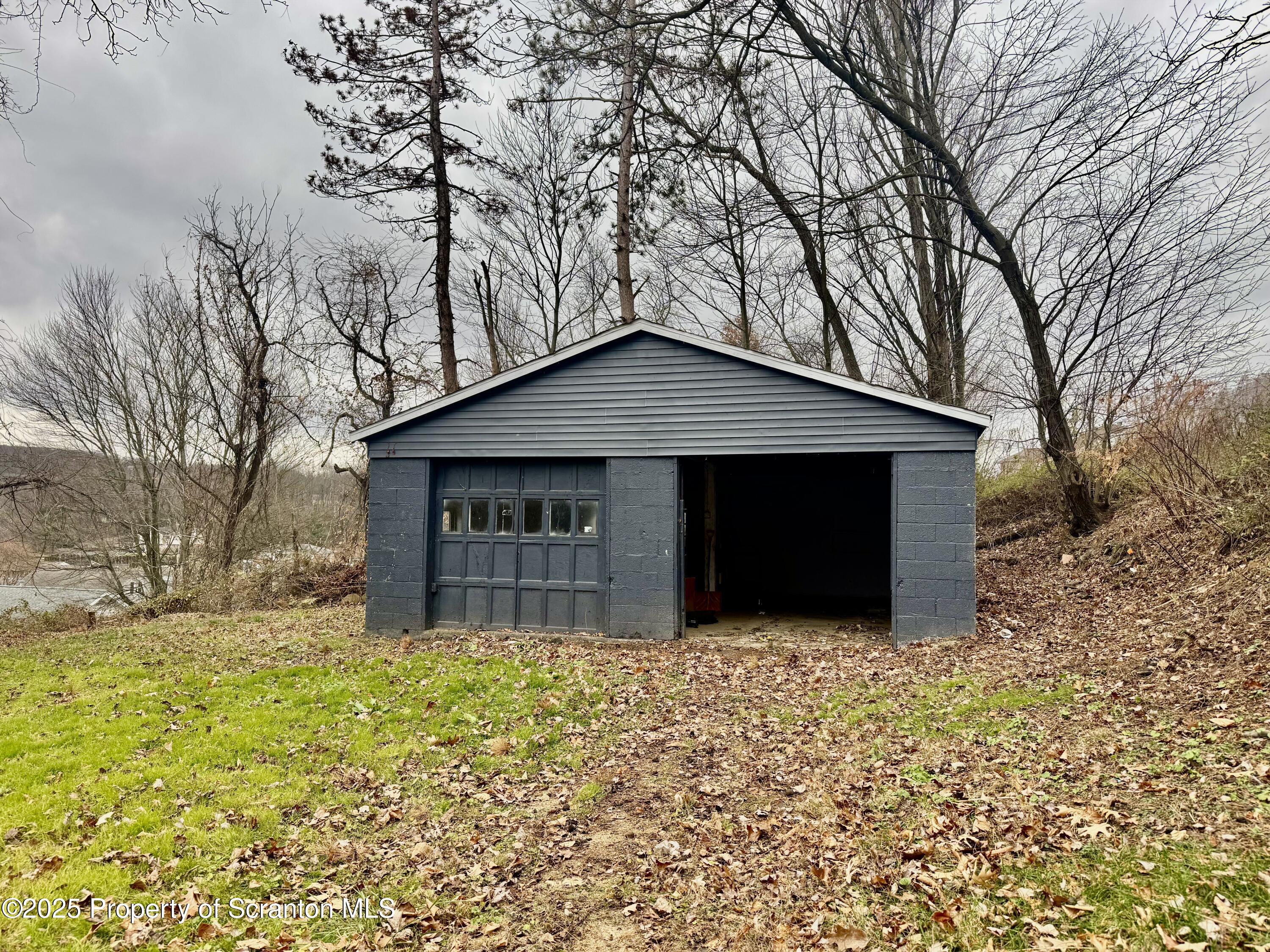 4 Maple Street Pittston, PA 18640 - Photo 22 of 25 a front view of a house with a yard