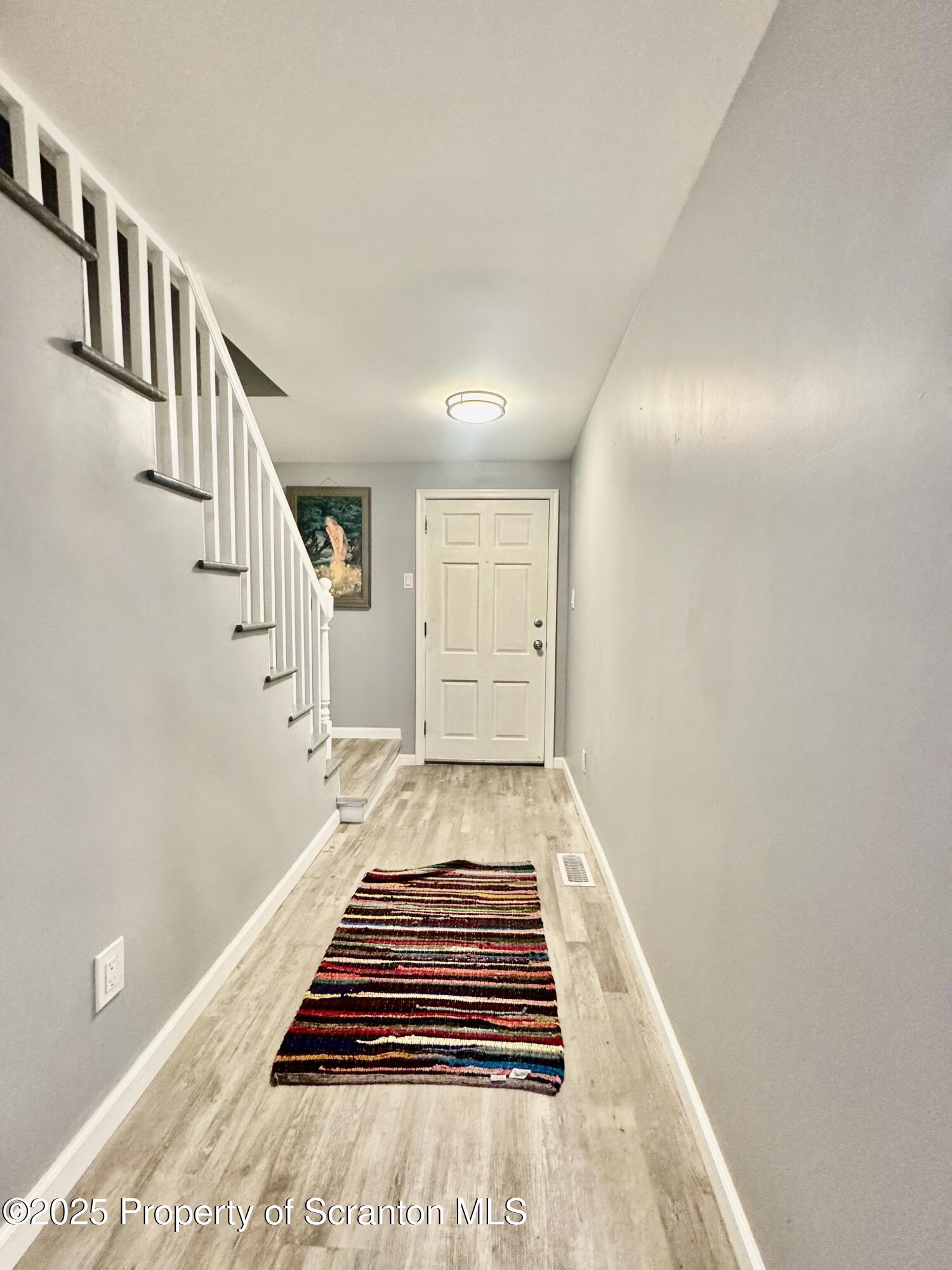 4 Maple Street Pittston, PA 18640 - Photo 4 of 25 a spacious bedroom with a bed and wooden floor