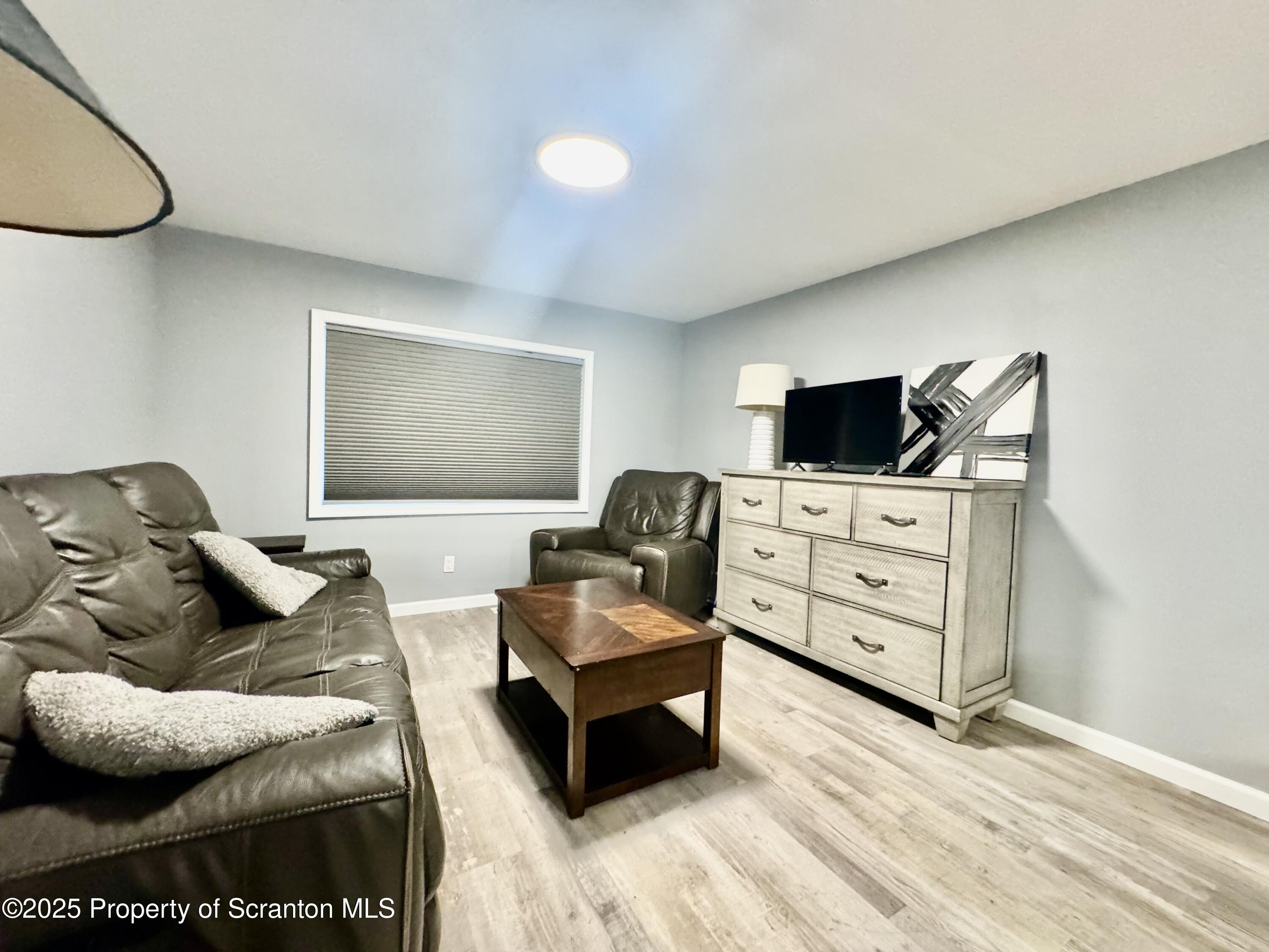 4 Maple Street Pittston, PA 18640 - Photo 6 of 25 a living room with furniture and a flat screen tv