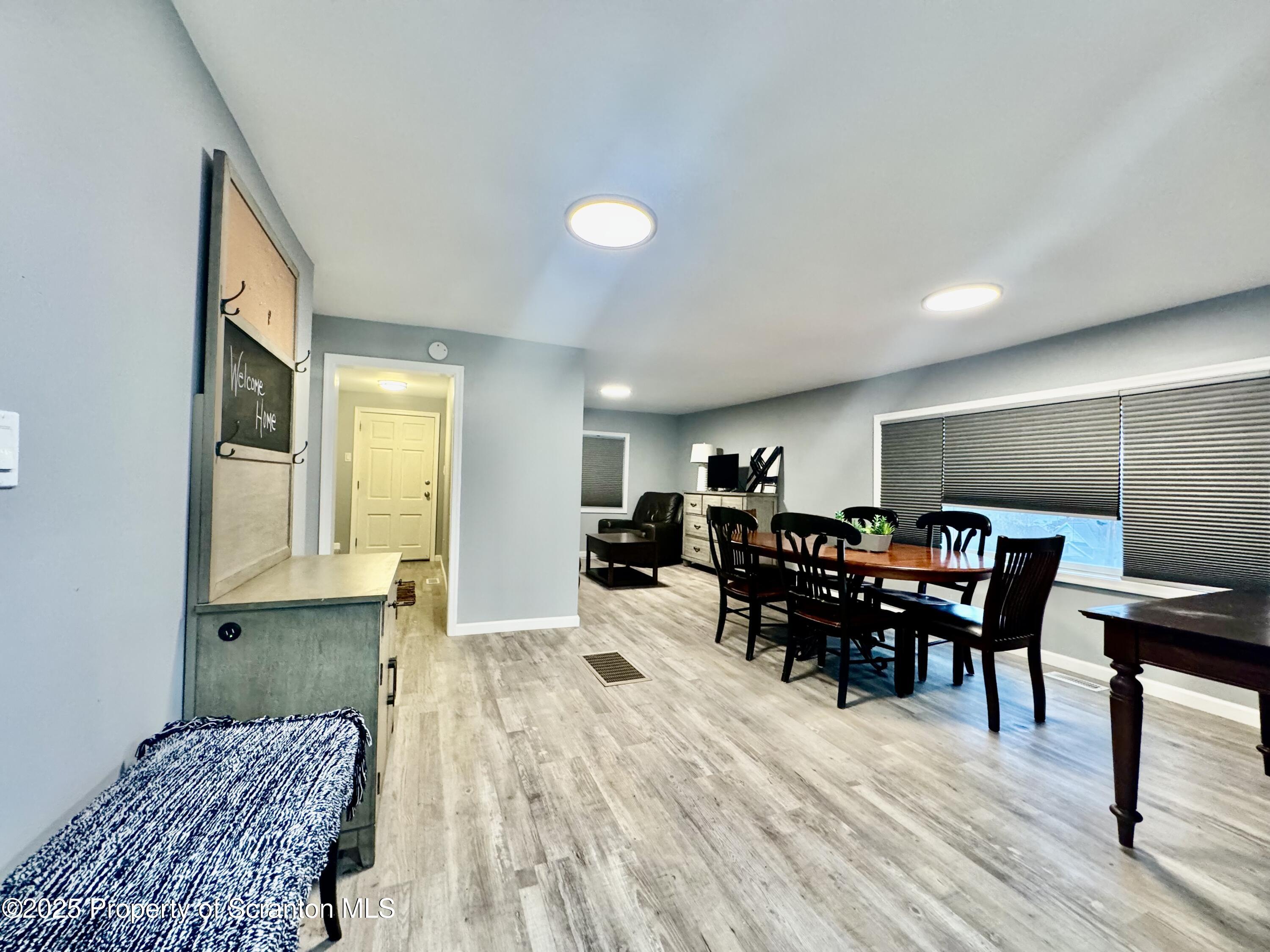 4 Maple Street Pittston, PA 18640 - Photo 9 of 25 a view of a dining room with furniture and wooden floor
