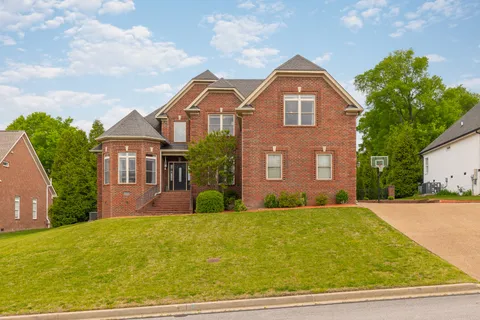 a front view of a house with yard