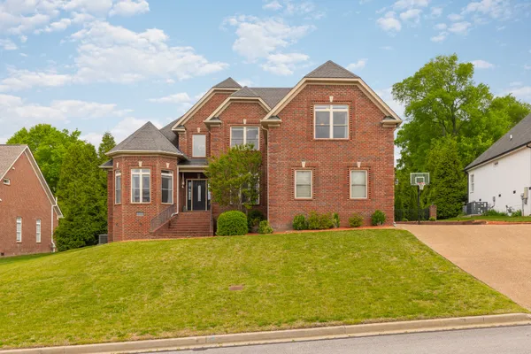 a front view of a house with yard