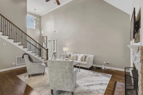 a living room with furniture and a rug
