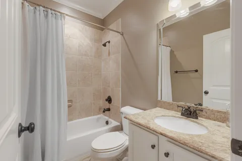 a utility room with sink dryer and washer