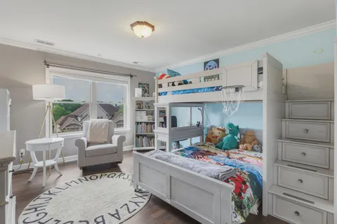 a view of a livingroom with furniture and staircase