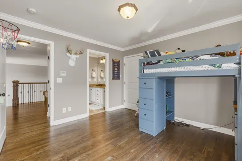 a living room with furniture ceiling fan and a rug