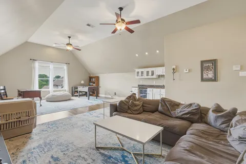 a kitchen with stainless steel appliances granite countertop a stove and cabinets