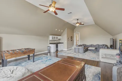 a view of room with furniture and wooden floor