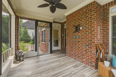 a view of a patio with swimming pool and furniture