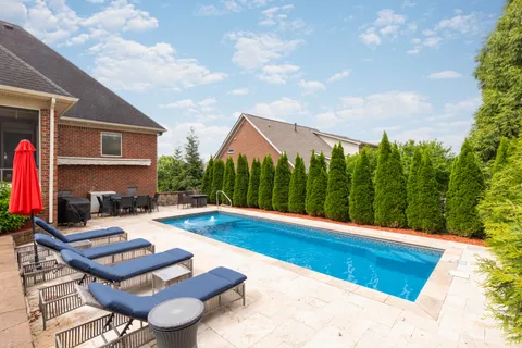 a backyard of a house with lots of green space
