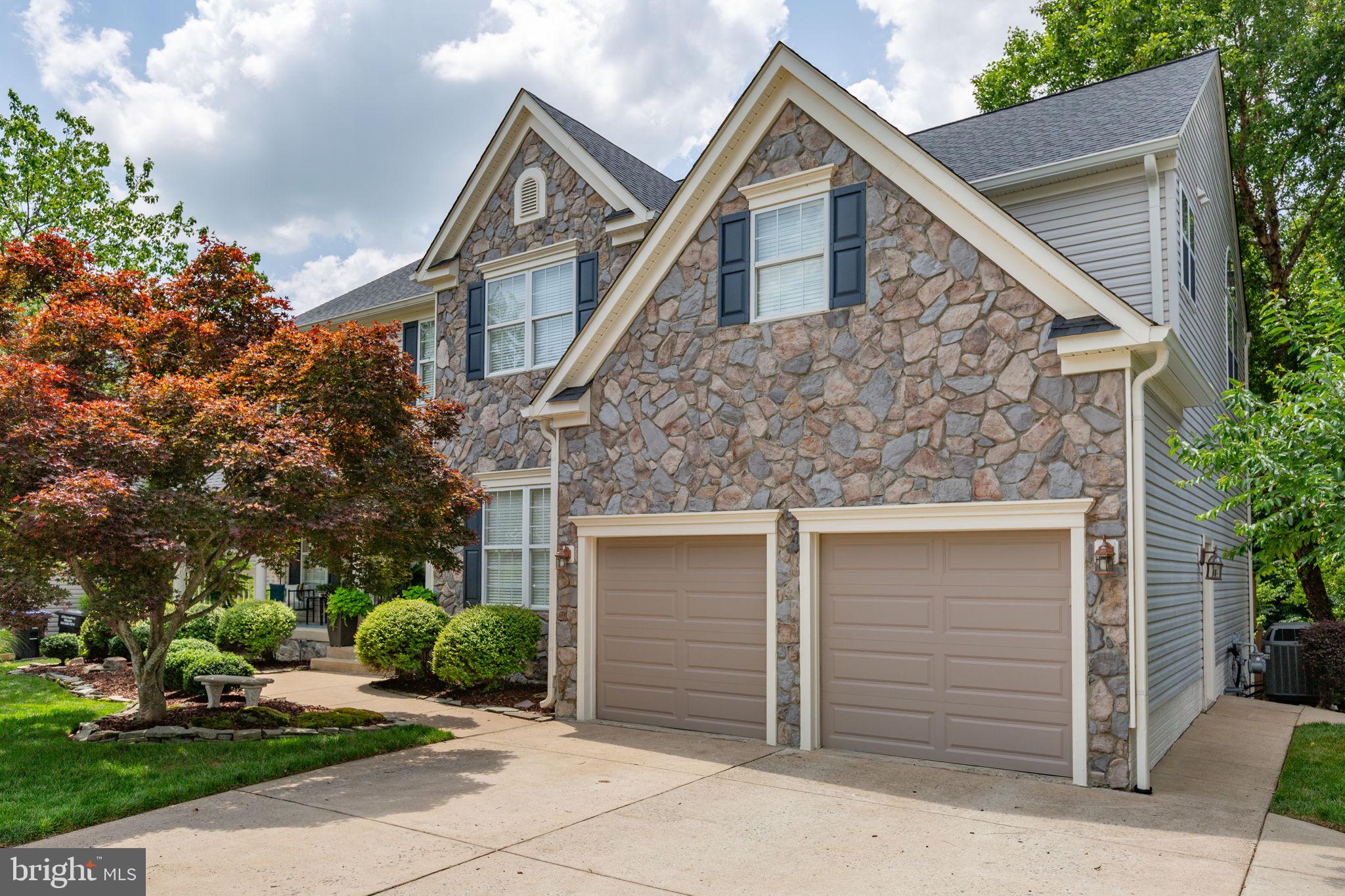 24 Tavern Road Stafford, VA 22554 - Photo 3 of 31 Concrete driveway & timeless stone/vinyl exterior