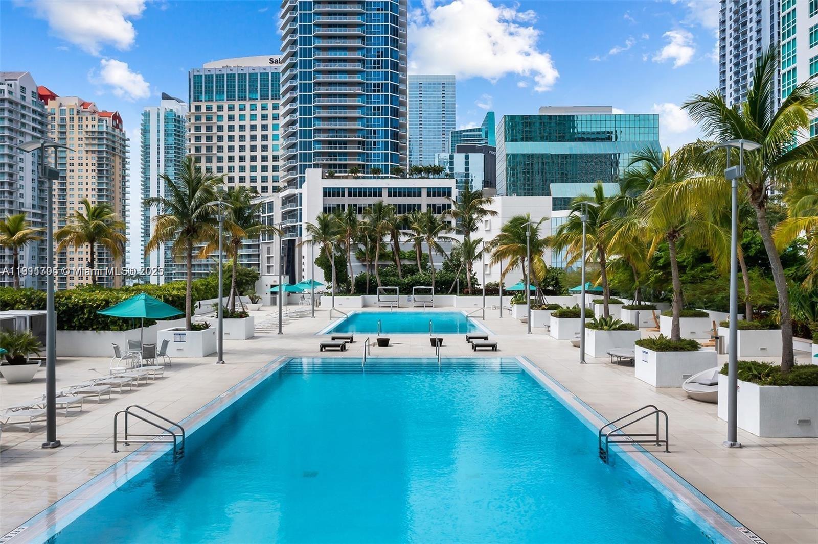951 Brickell Avenue, Unit 2601 Miami, FL 33131 - Photo 18 of 21 a swimming pool with outdoor seating and yard
