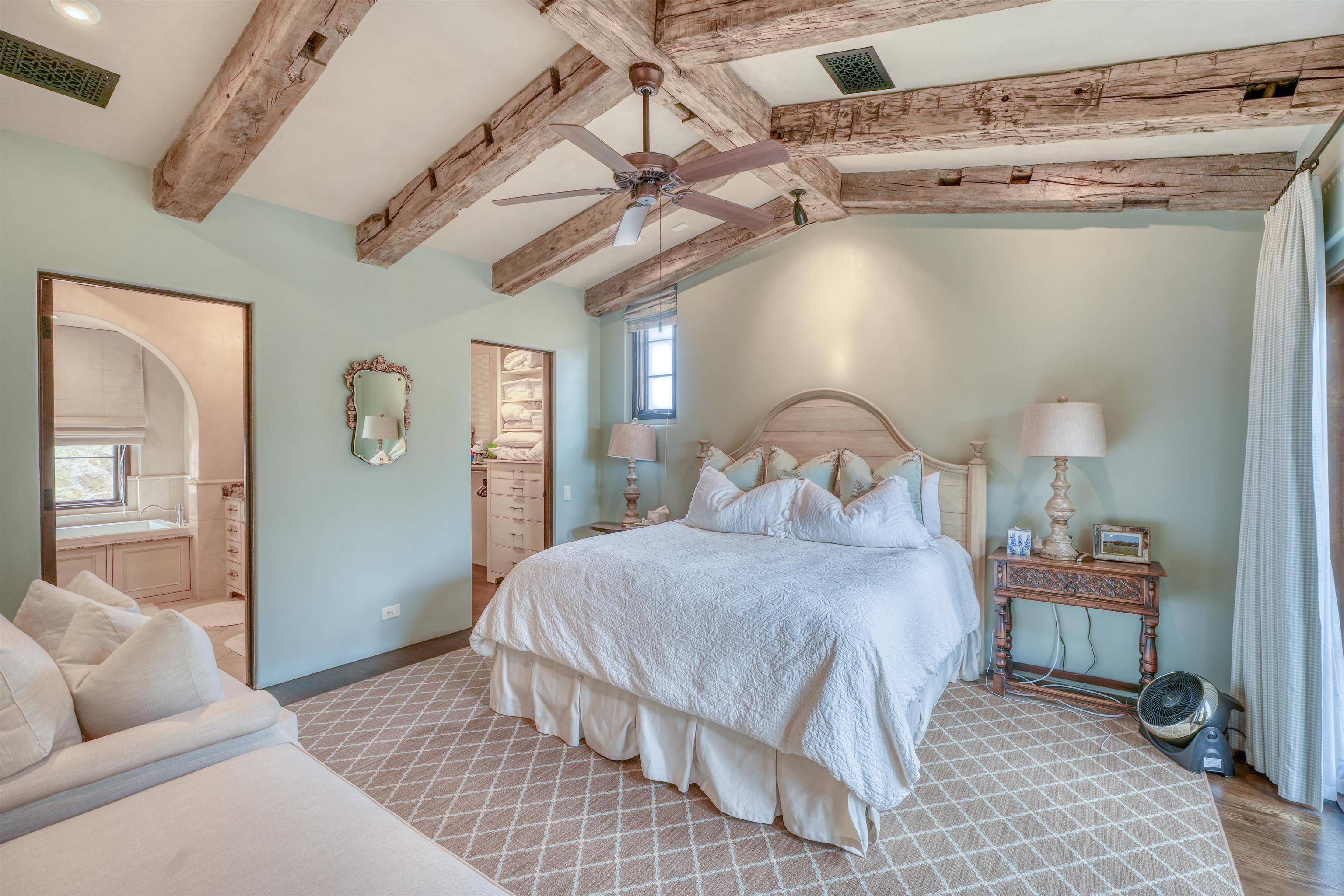 107 Bent Way Road Horseshoe Bay, TX 78657 - Photo 11 of 29 a bedroom with a bed and wooden floor