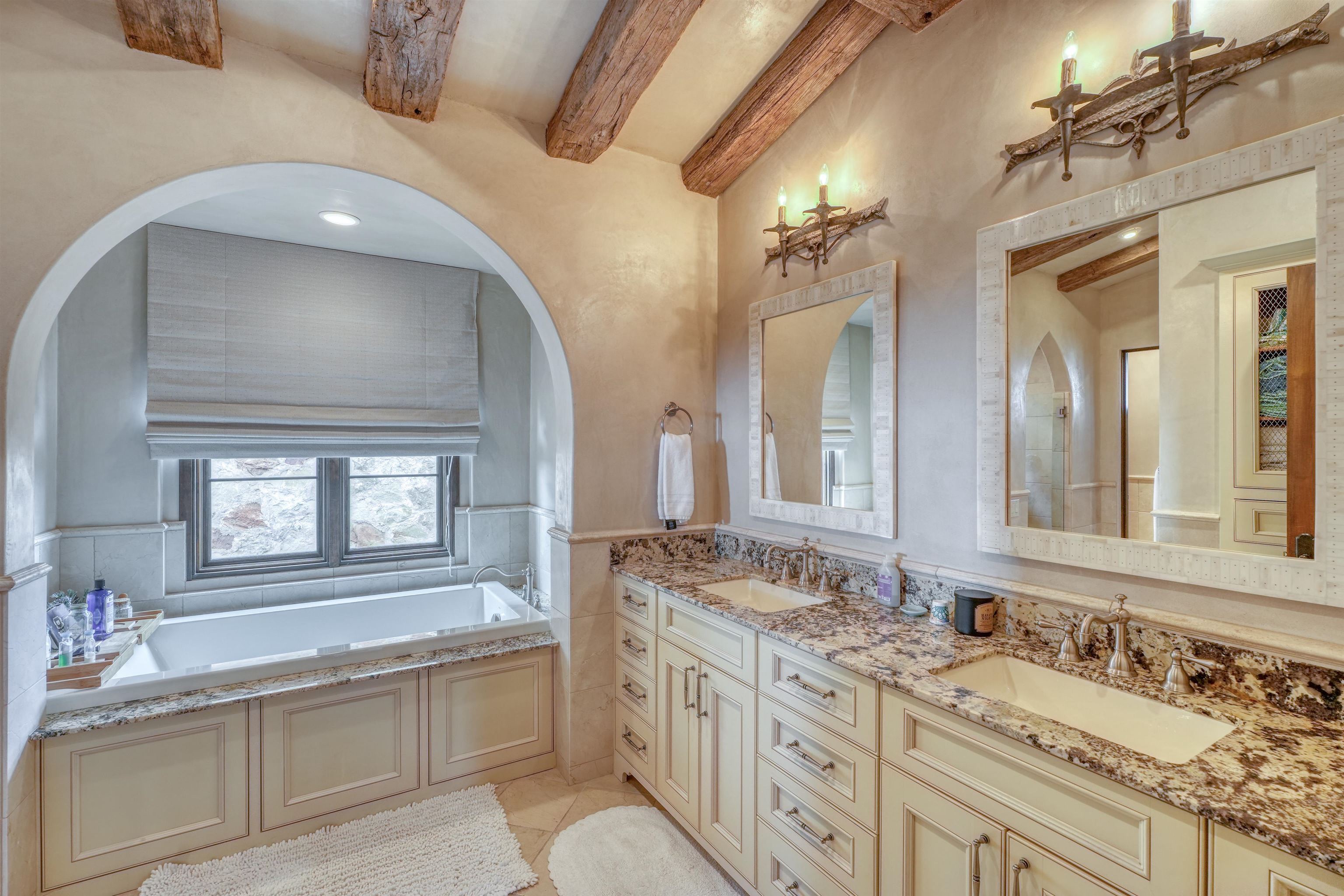 107 Bent Way Road Horseshoe Bay, TX 78657 - Photo 12 of 29 a bathroom with a granite countertop double vanity sink and a mirror