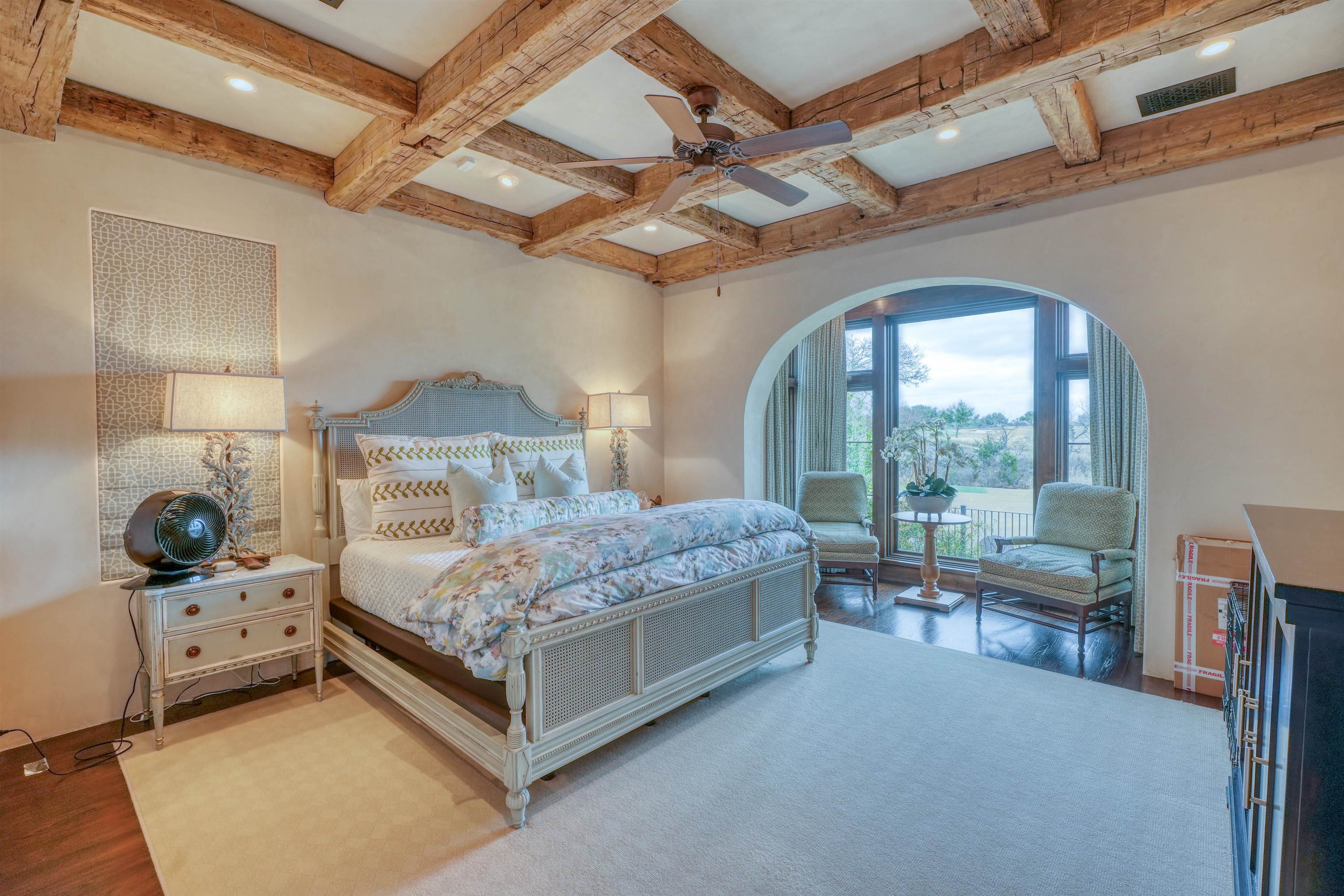 107 Bent Way Road Horseshoe Bay, TX 78657 - Photo 13 of 29 a bedroom with a bed and large window with view of balcony