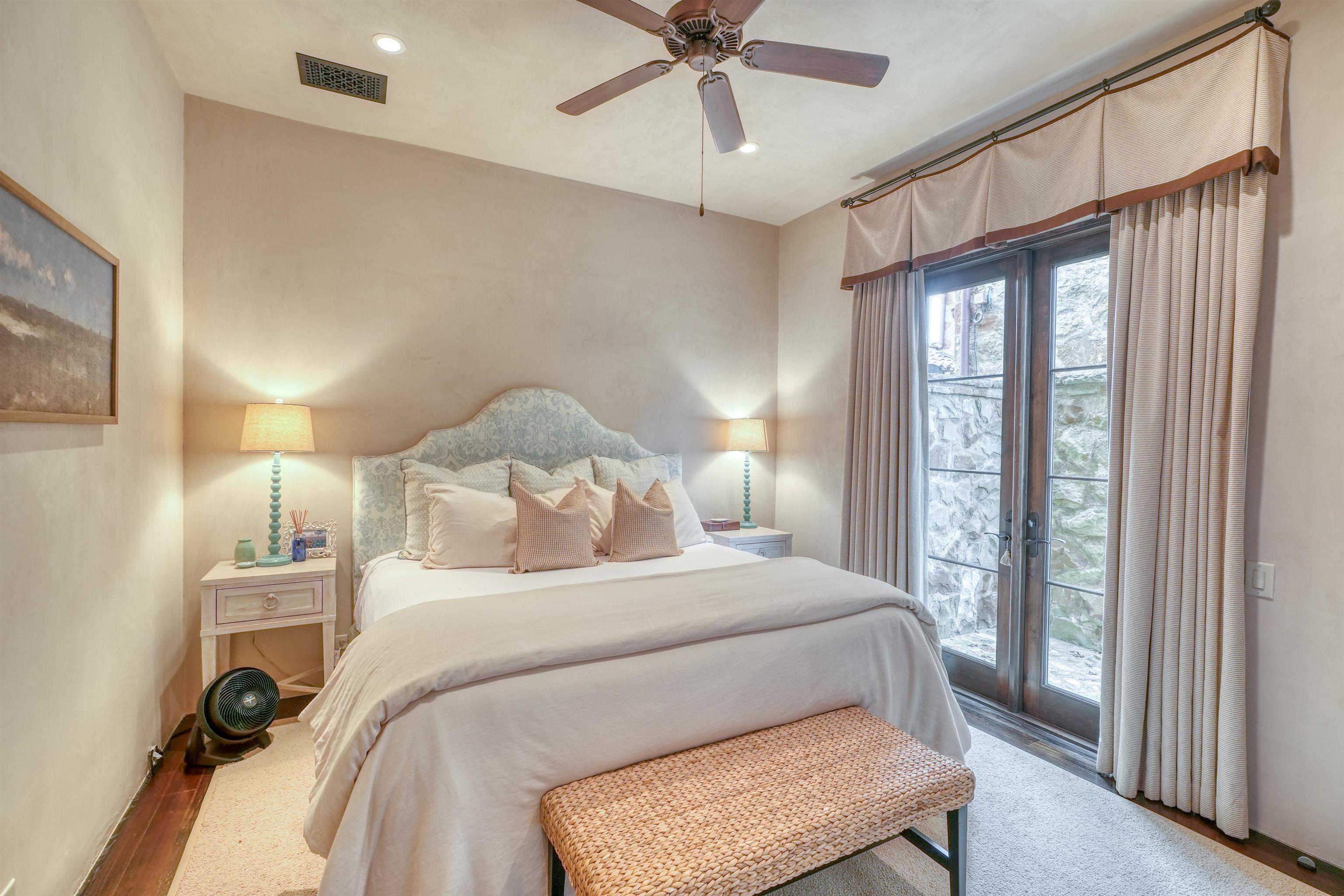 107 Bent Way Road Horseshoe Bay, TX 78657 - Photo 16 of 29 a bedroom with a bed and a window