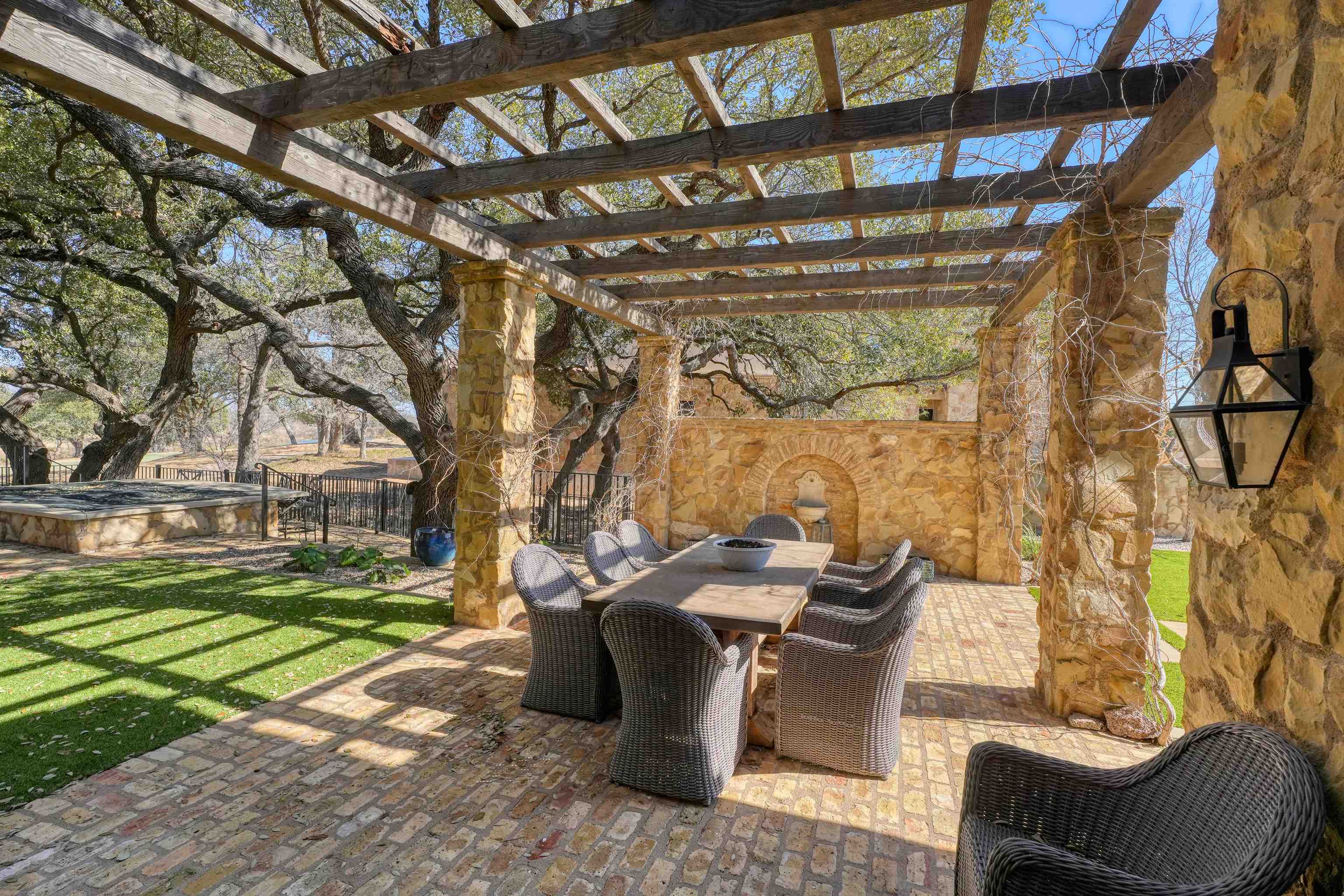 107 Bent Way Road Horseshoe Bay, TX 78657 - Photo 21 of 29 a view of a patio with table and chairs and potted plants