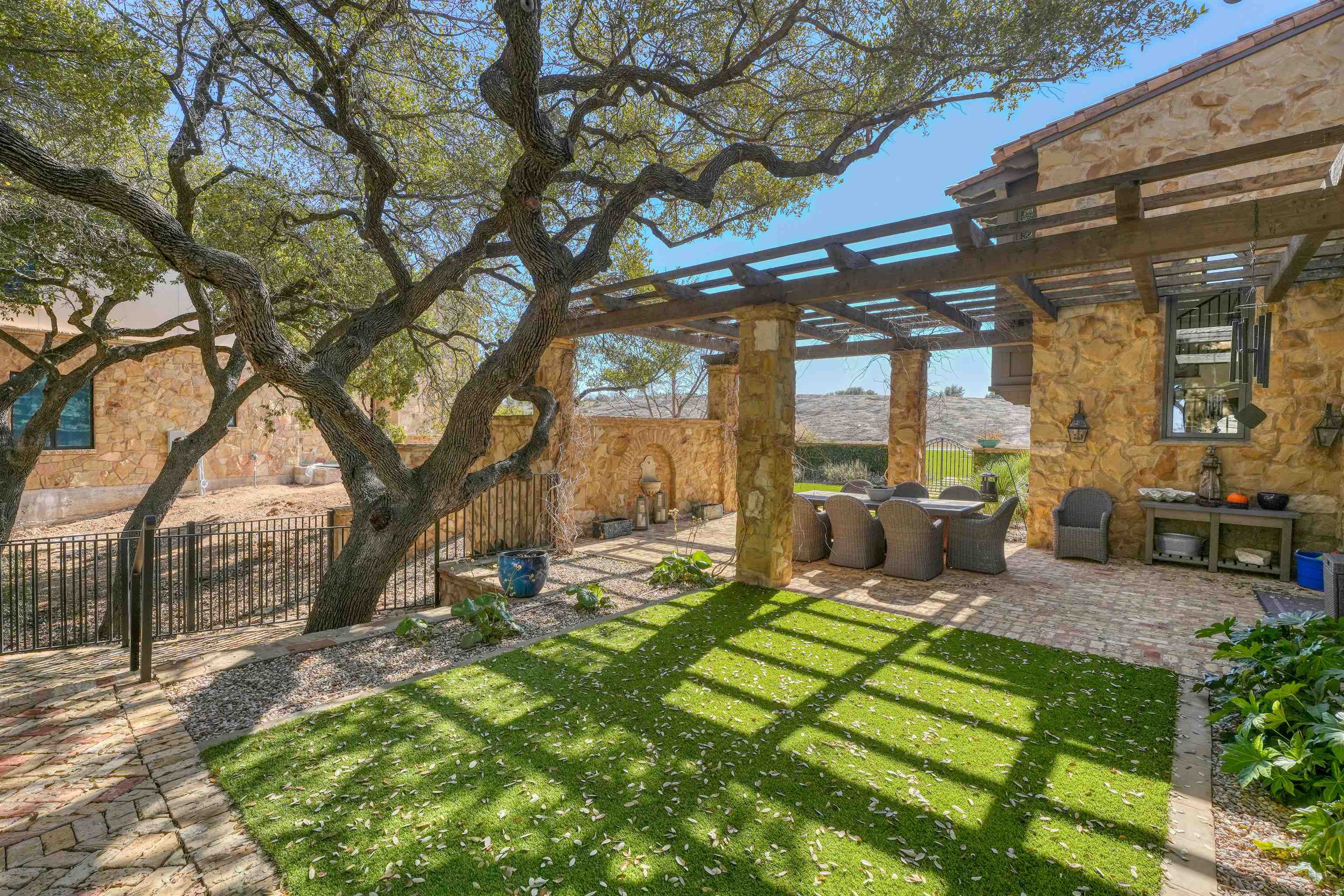 107 Bent Way Road Horseshoe Bay, TX 78657 - Photo 27 of 29 a view of a backyard with sitting area