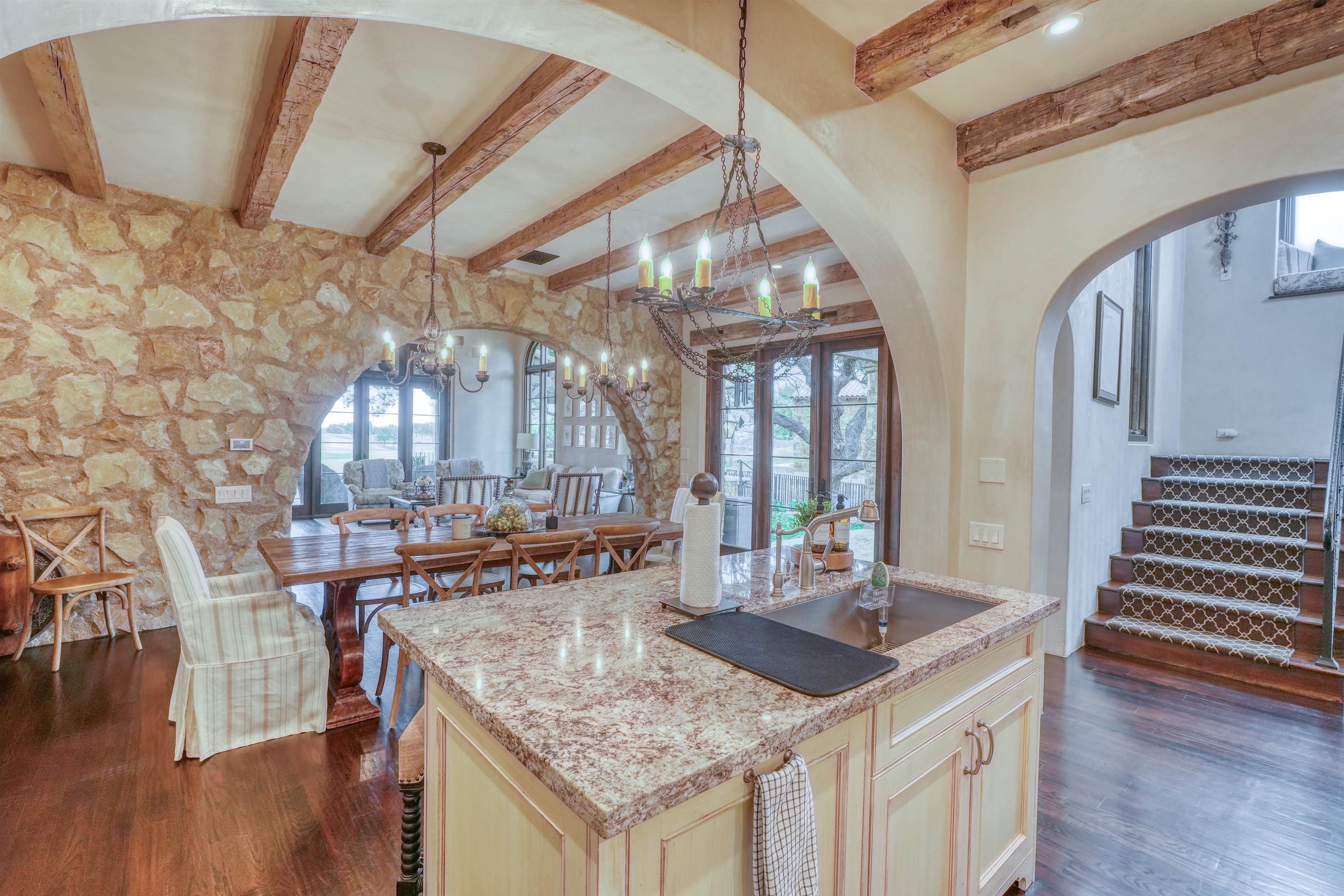 107 Bent Way Road Horseshoe Bay, TX 78657 - Photo 6 of 29 a kitchen with stainless steel appliances granite countertop a stove and cabinets