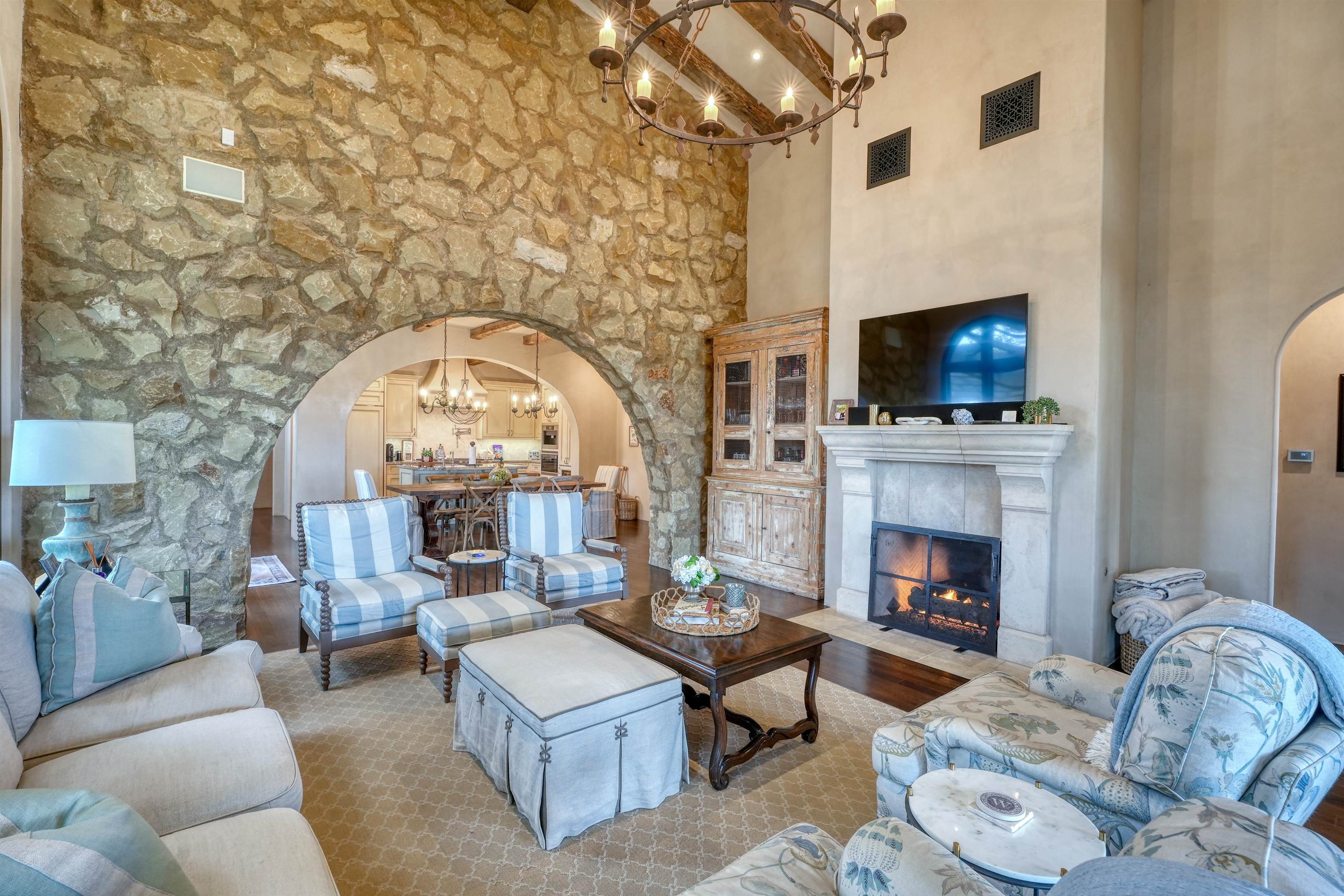 107 Bent Way Road Horseshoe Bay, TX 78657 - Photo 9 of 29 a living room with furniture a fireplace and a flat screen tv