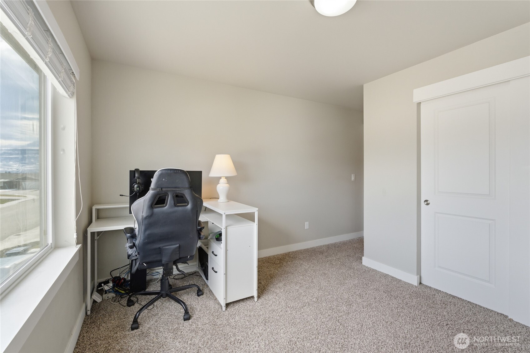 2247 S. Mystical Loop East Wenatchee, WA 98802 - Photo 14 of 25 a view of a workspace with furniture and a window