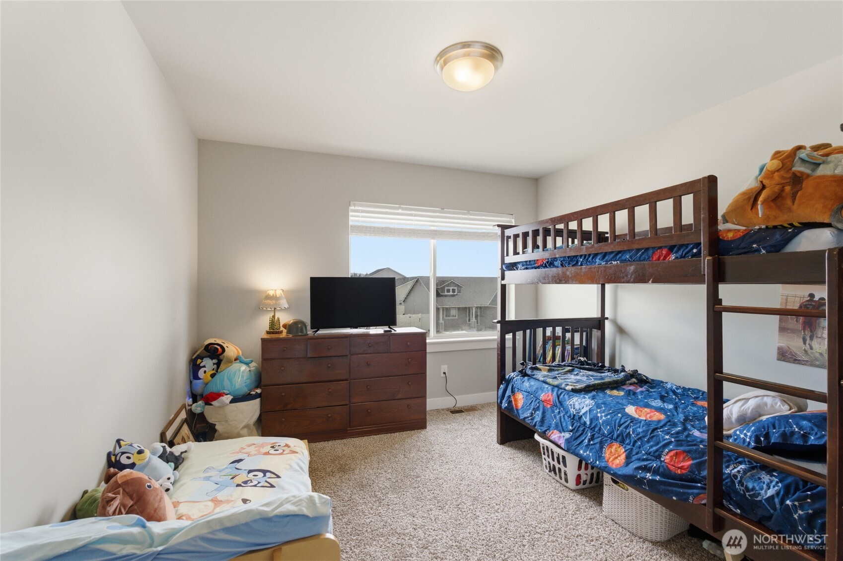 2247 S. Mystical Loop East Wenatchee, WA 98802 - Photo 15 of 25 a bedroom with furniture and a flat screen tv