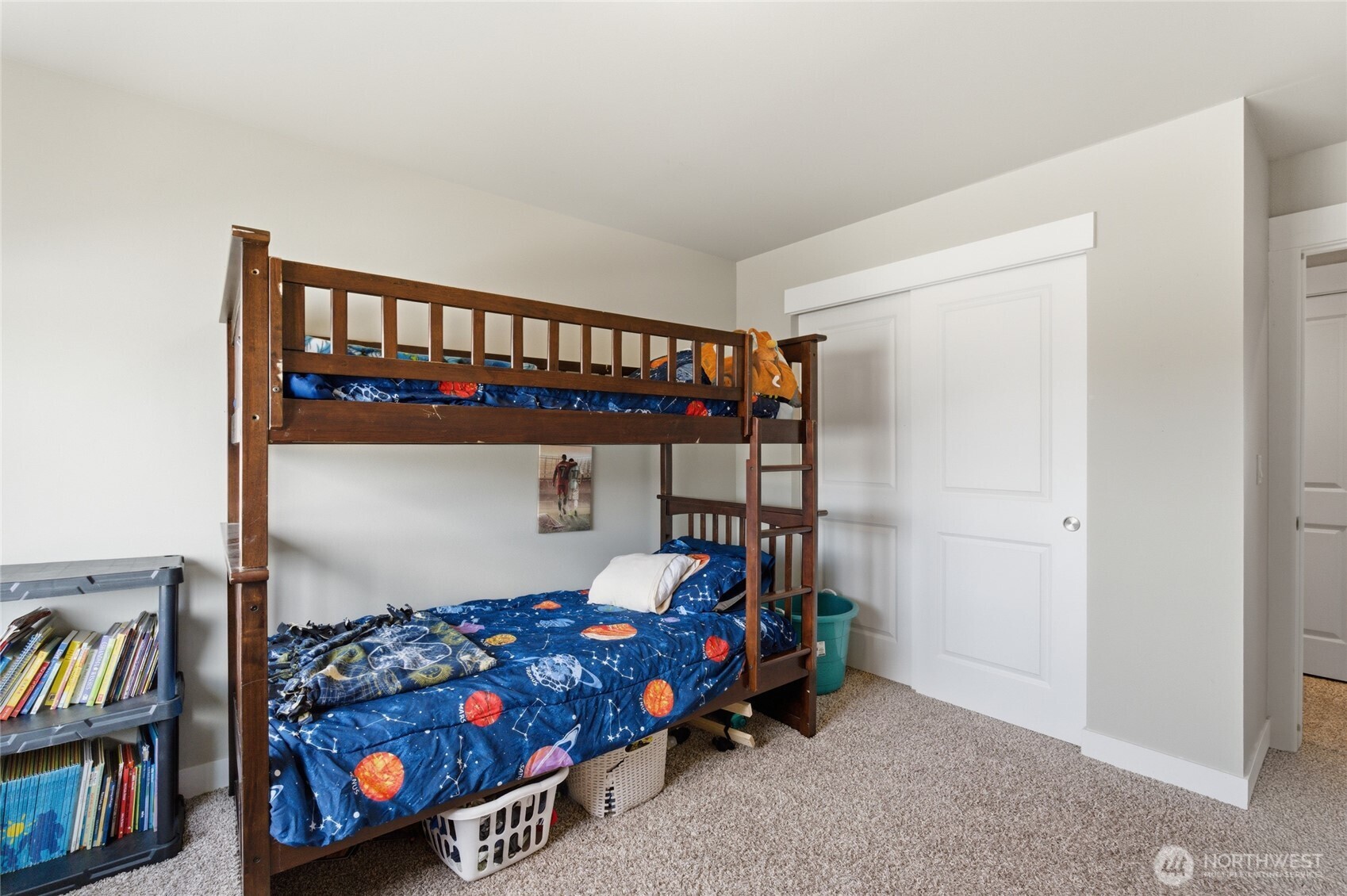 2247 S. Mystical Loop East Wenatchee, WA 98802 - Photo 16 of 25 a bedroom with a bed and a book shelf