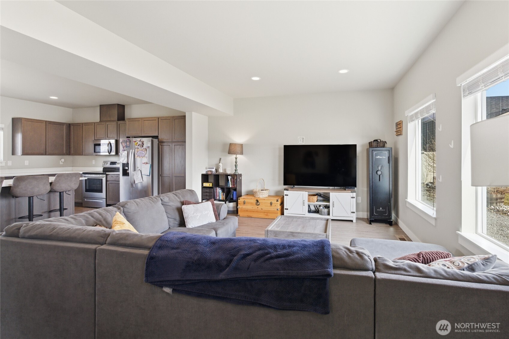 2247 S. Mystical Loop East Wenatchee, WA 98802 - Photo 2 of 25 a living room with furniture and a flat screen tv