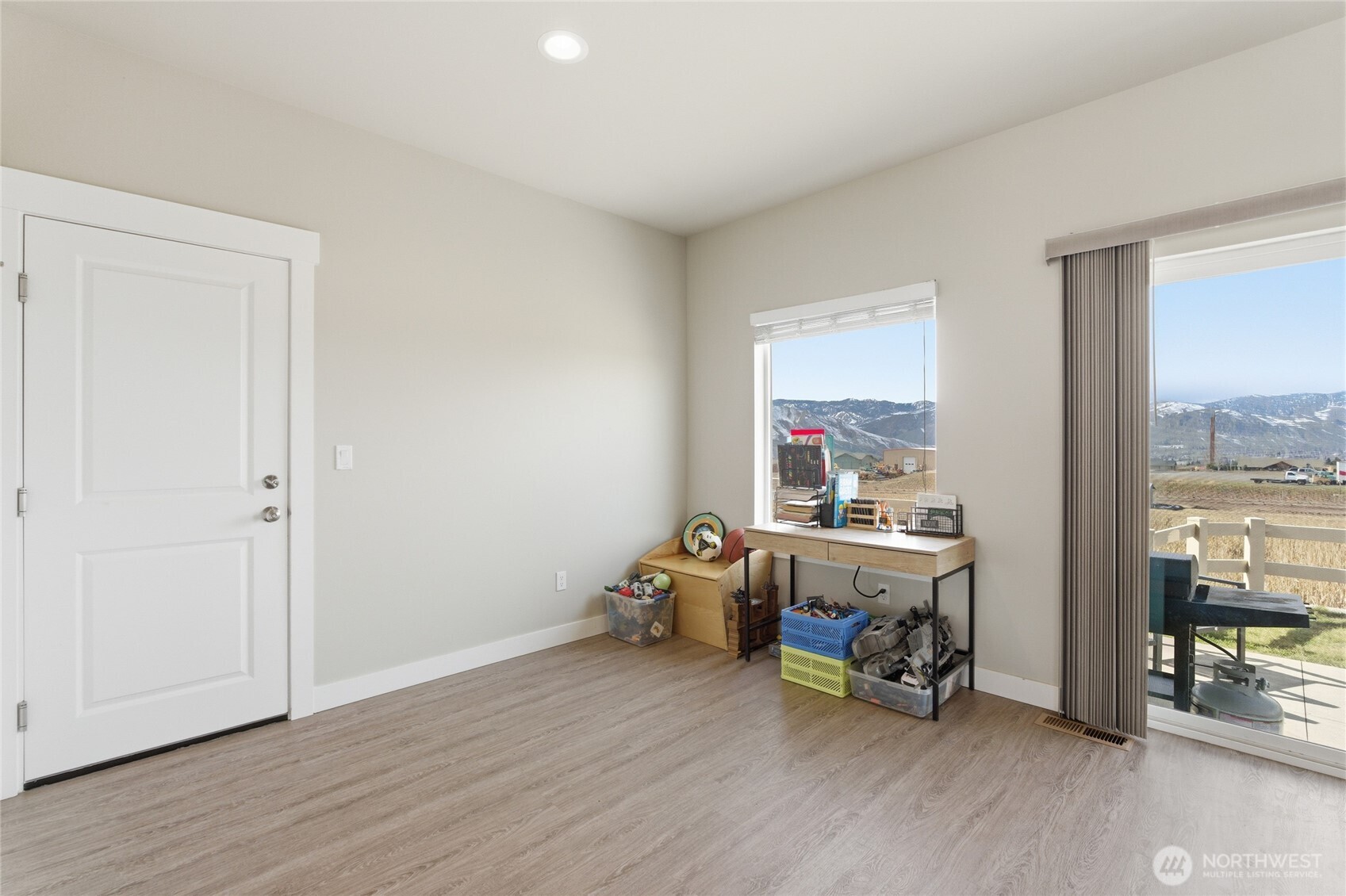 2247 S. Mystical Loop East Wenatchee, WA 98802 - Photo 7 of 25 a room with furniture and a wooden floor